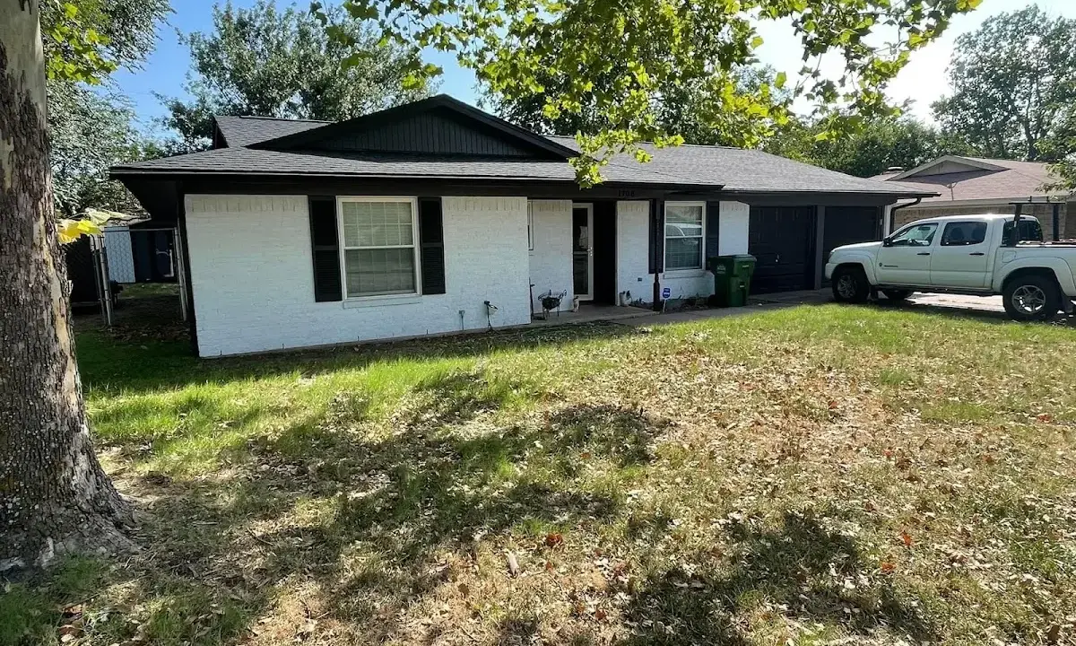Professional roofing crew working on a residential roof in Largo